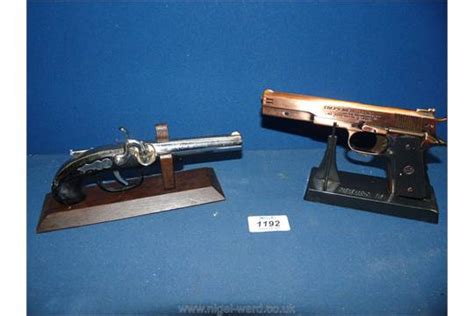 Two Novelty Pistol Cigarette Lighters Including Colt 45 Automatic