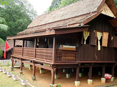 This drawing depicts a traditional malay house situated near a forest. Ibu Sham: Malaysian Traditional Houses Fridge Magnet