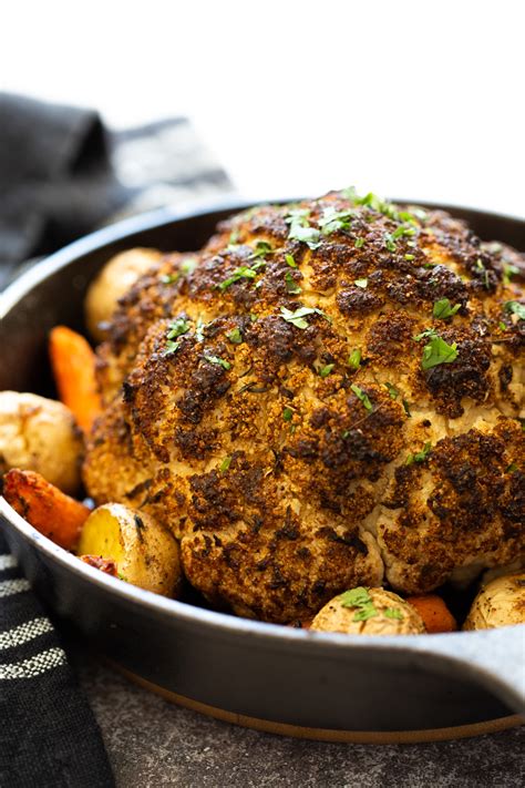 It is bursting with flavor, caramelized edges and the quickest side dish to every meal all made in one pan! Baked Whole Roasted Cauliflower - Vegan Richa