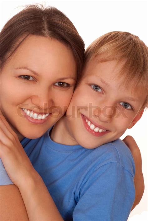 mom holding her smiling son stock image colourbox