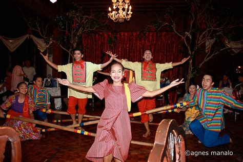 filipino dancers performing traditional philippine folk dance which vrogue