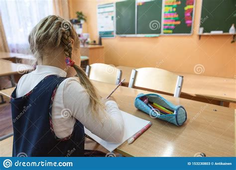 Female Pupil Is On Academic Detention In School Class For Completion Of