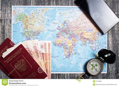 Passport Money Compass And Camera On Map Stock Photo