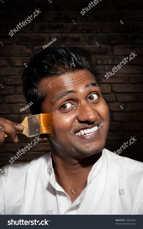 Handsome Indian Man Painting His Face Stock Photo 72605365