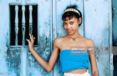 Cuban Girl Posing Beside Door Of Colonial Home Santiago De