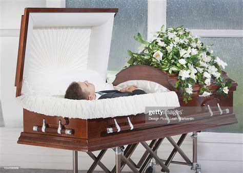 I choose to sleep in it because of the advantages of that it makes it very dark and blocks out noise. A Deceased Man Laying In A Coffin High-Res Stock Photo ...