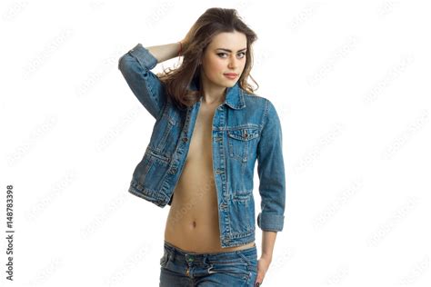 Beautiful Babe Girl In Denim Jacket With A Naked Belly Poses On Camera Stock Photo Adobe Stock