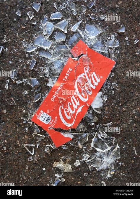 Coca Cola Bottle Broken On The Sidewalk Stock Photo Alamy