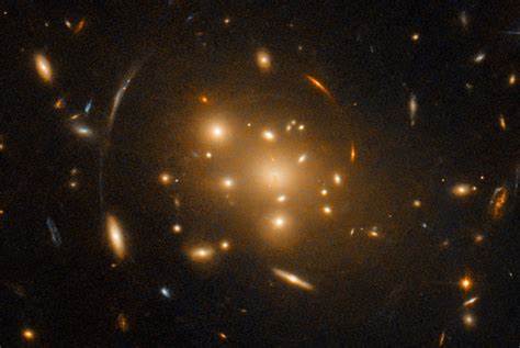 Hubble Space Telescope Observes Large Galaxy Cluster Contorted By