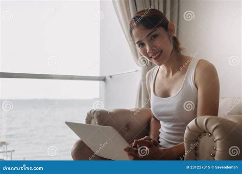 Woman Works And Relax With Laptop On The Sofa Concept Of Work From Hotel Stock Image Image