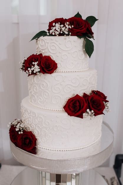 Wedding Cake Decorated With Red Roses Free Photo