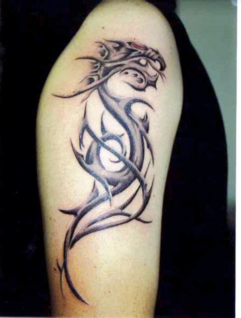 Cool Dragon Tattoo On Biceps For More Tattoo Designs And Ideas Visit