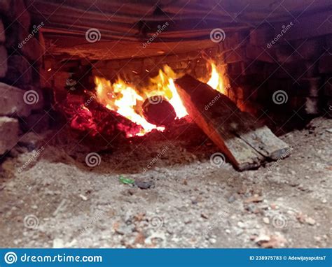 A Blazing Fire That Burns Wood To Charcoal And Ashes Stock Image