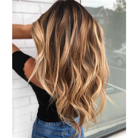 Elegant sunkissed hair extensions with highlights from foxy locks! Sun-Kissed Balayage - Behindthechair.com