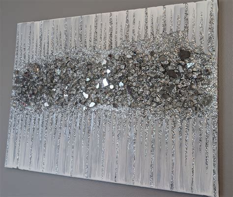 A Painting With Lots Of Silver Sequins On Its Side Hanging On A Wall