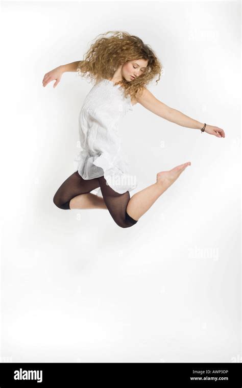 Young Woman Jumping Stock Photo Alamy