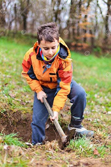 Boy Digging In The Ground Stock Photo Image Of Happy 24325106