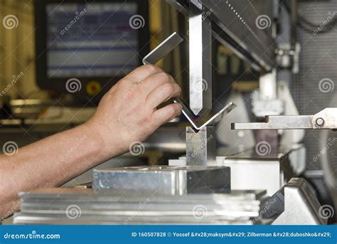 Worker Operating Metal Press Machine At Workshop Stock Photo Image Of