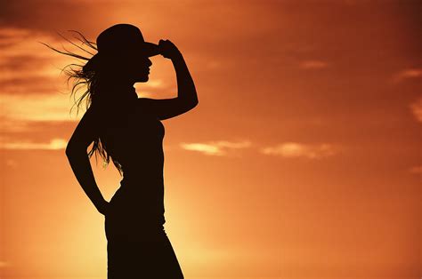 Cowgirl Silhouette In A Hot Orange Western Sky Photograph By Kriss Russell