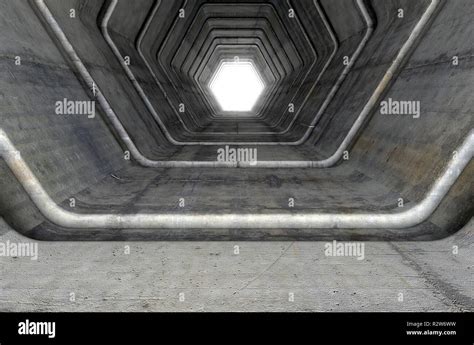 A Look Down A Concrete Tunnel Made Out Of Hexagonal Geometric Shapes