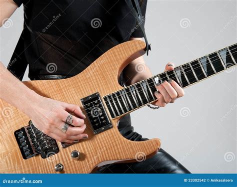 Female Guitarist Playing Electric Guitar Stock Photo Cartoondealer