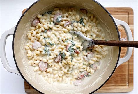 Pour the chicken broth and water into the instant pot container. White Cheddar Mac and Cheese with Sausage & Spinach ...