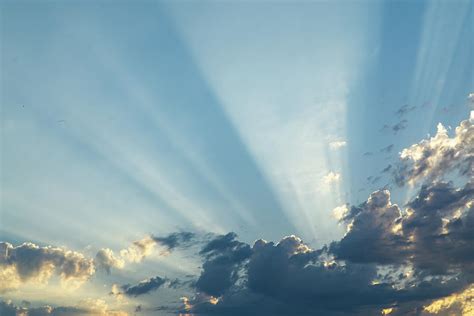 Sunbeam And Clouds In The Sky Photograph By Cavan Images Pixels