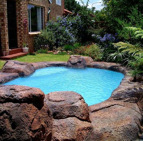 Rocky areas in the yard don't have to be ignored: Artificial Rock pool by Designer Gardens Landscaping www ...