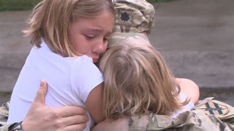 military father surprises daughters at school