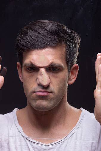 Young Man Head Face Pressed Against Glass Stock Photo Download Image