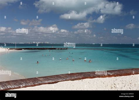 Tourists Swimming In The Clear Blue Caribbean Sea Cancun Mexico Stock