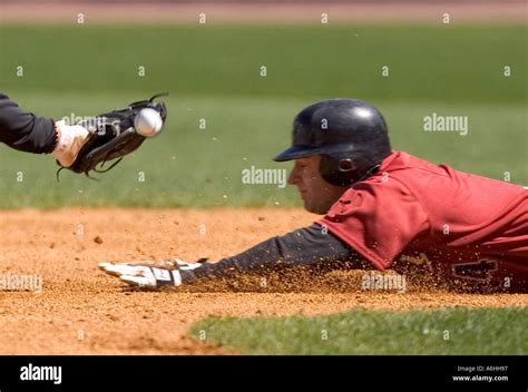 Baseball Player Sliding Into A Base Stock Photo Alamy