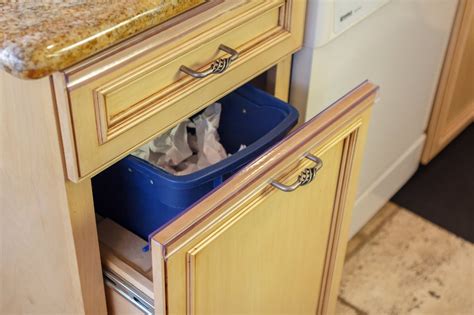 Attaches to back of door with 6 way adjustability. Slip to on your trash pull out drawer to guard against ...