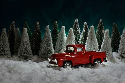 Premium Photo A Toy Red Chevrolet Pickup Truck Carries A Christmas