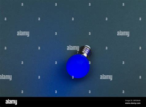 Blue Light Bulb On The Dark Background Single Bulb With Copy Space