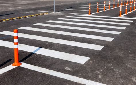 White Traffic Markings With A Pedestrian Crossing On A Gray Asph Stock