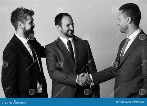 Men With Beard And Smiling Faces Make Successful Deal Ceos Shake Hands On Light Grey Background