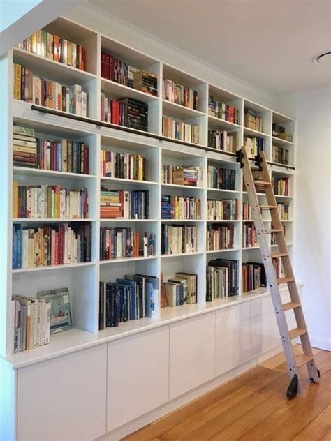 The Built In Bookshelves And Rolling Ladder In The Library Bookshelf