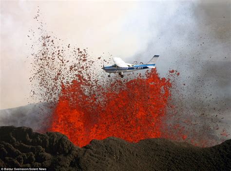Plane Flies Over Iceland Volcano Spewing Lava For The Perfect Action