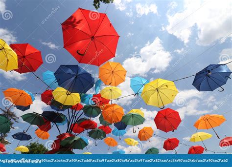 Colorful Umbrellas Flying In The Summer Blue Sky Editorial Photo