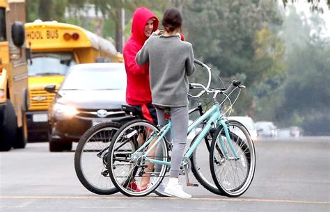 justin bieber and selena gomez snuggle bike ride through los angeles pics us weekly