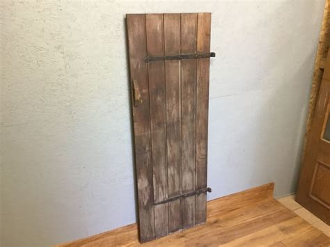 A ledge door consists of multiple vertical planks fixed together by two horizontal planks (the ledges) for reinforcement. Stained Reclaimed Oak Ledge Door - Authentic Reclamation