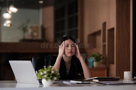 Stressed Business Woman Working On Laptop Looking Worried Tired And