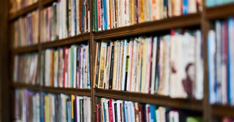 Assorted Books On Wooden Shelf · Free Stock Photo