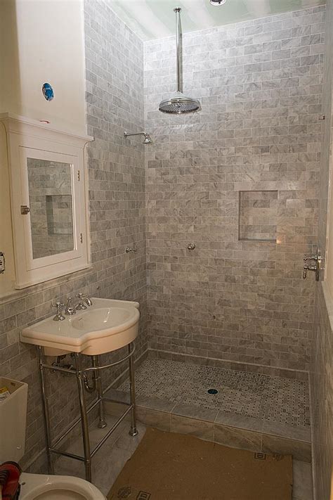 A seamless floor tile transition into the shower. Marble Subway Tile Shower Offering the Sense of Elegance ...