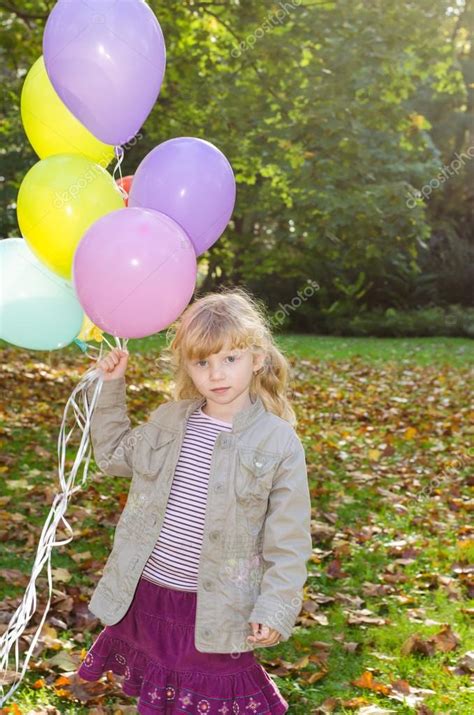 Girl Holding Balloons — Stock Photo © Katarinagondova 55980903