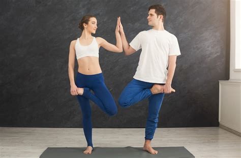 Premium Photo Man And Woman Training Yoga In Balance Pose Young