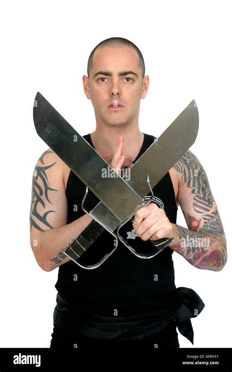 A Martial Arts Master Holding Two Swords Stock Photo Alamy