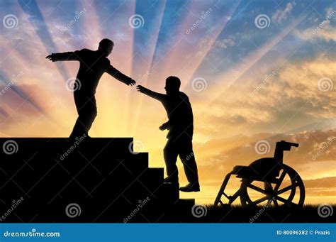 Man Gives Helping Hand To Disabled Person In Wheelchair Stock Photo