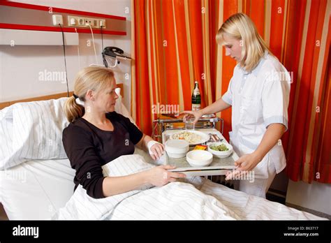 Nurse Serves Lunch For A Patient In A Hospital Stock Photo Alamy
